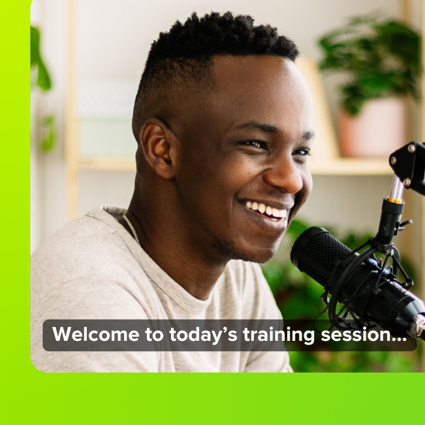 man speaking into microphone with closed captions